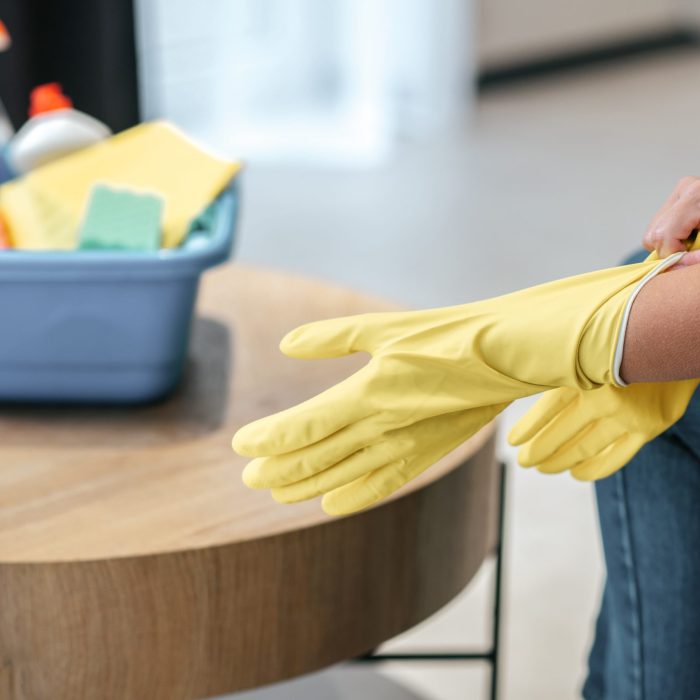 Gloves. Close up picture of female hands taking on gloves